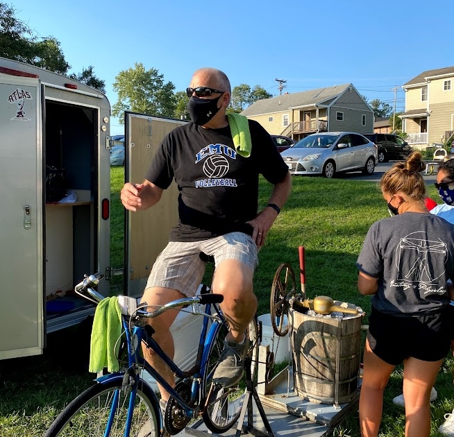 David King sits on top of the bike he uses to make ice cream. 